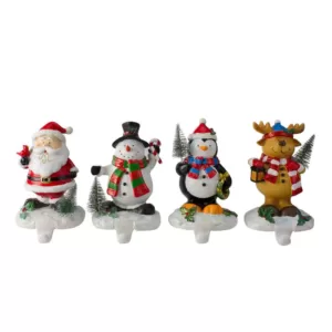 Northlight 5.75 in. Plastic Santa Snowman Penguin and Reindeer Christmas Stocking Holders (Set of 4)